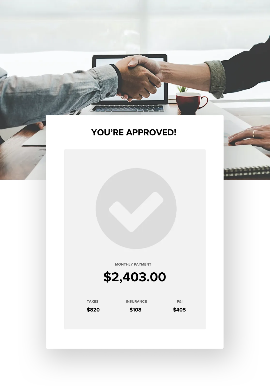 Borrowers shaking hands at a desk with a loan approval card